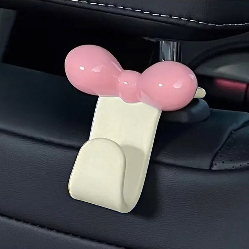 Car Accessories Useful - ミニマリストなボウ型車用後部座席吊り下げフック、実用的な収納アクセサリー、ハンドバッグ、軽食、車内旅行用品用